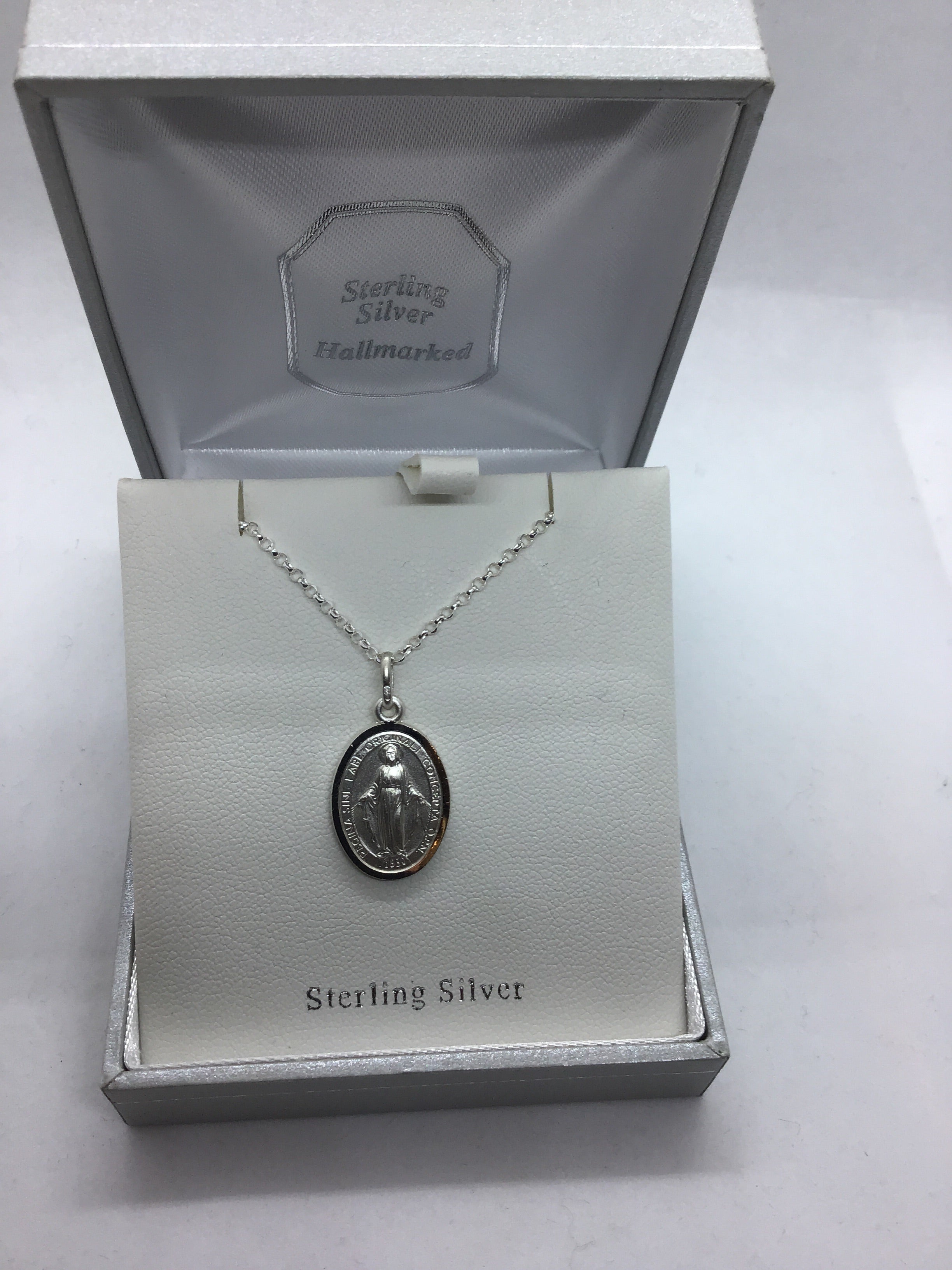 Silver Miraculous Medal on Chain.